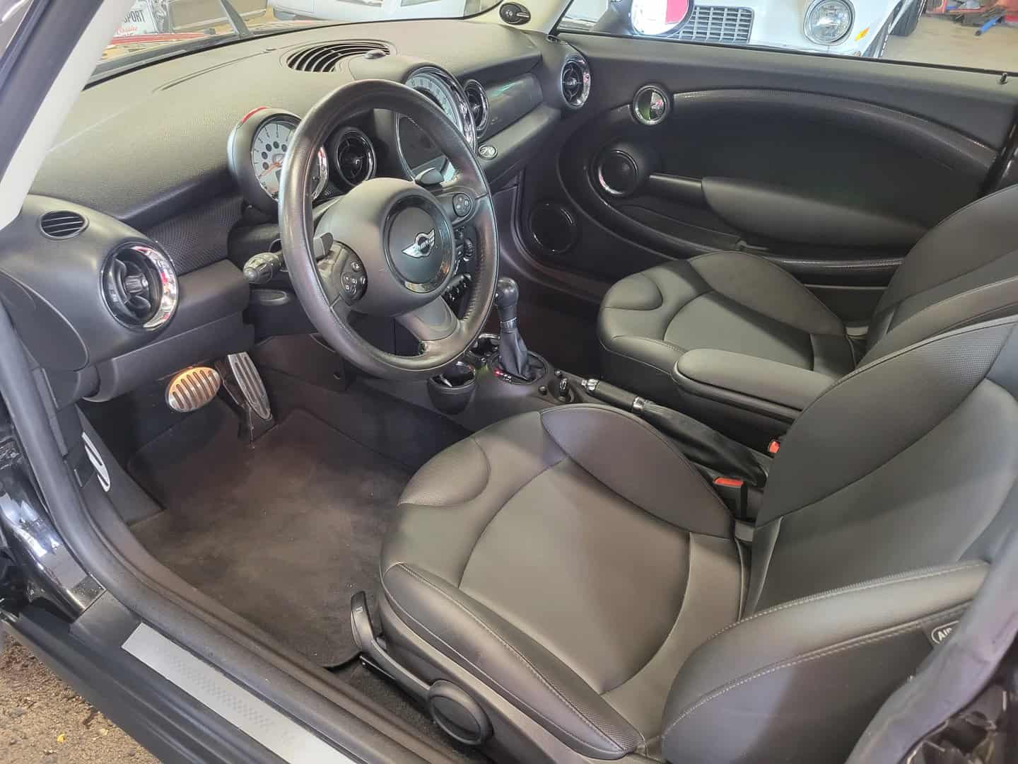 The 2013 Mini Cooper S boasts a stylish and sleek interior.