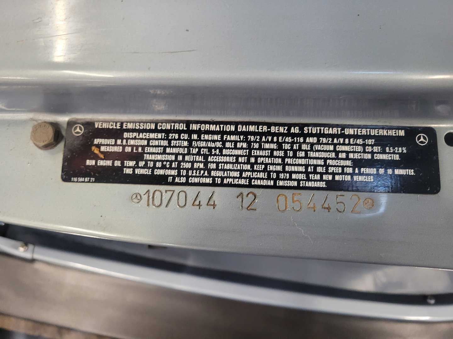 A Close Up Of A Silver Mercedes Benz Machine With A Label On It.